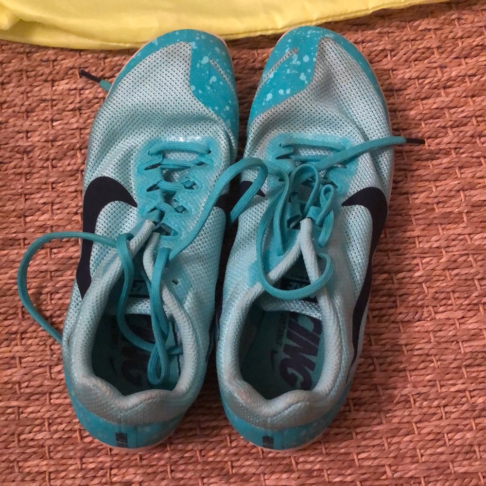 Pair of sea foam green/ teal track spikes.